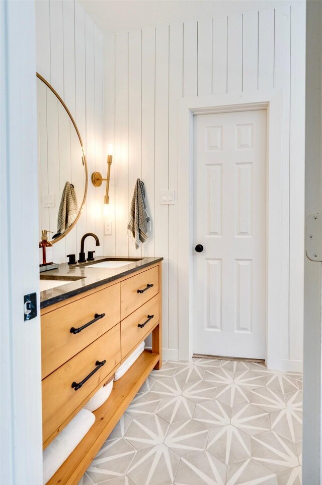 bathroom with tile patterned floors and vanity