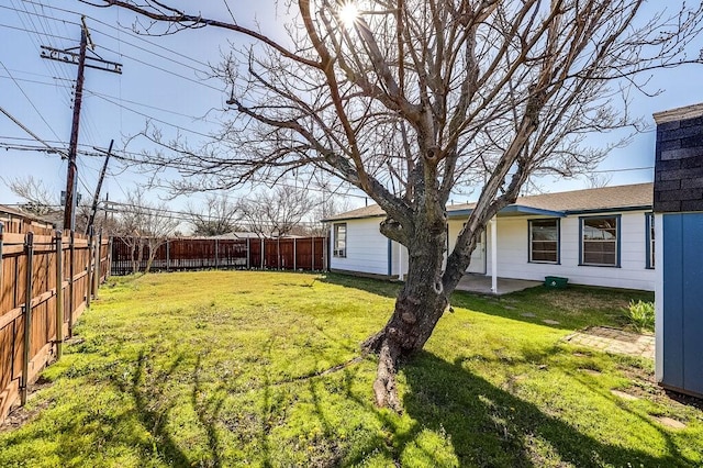 view of yard featuring a fenced backyard and a patio area