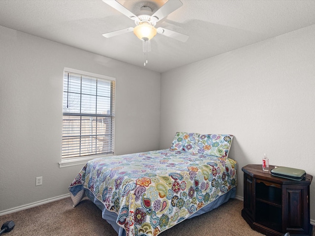 bedroom with baseboards, carpet, and a ceiling fan