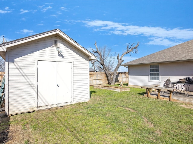 view of shed with fence