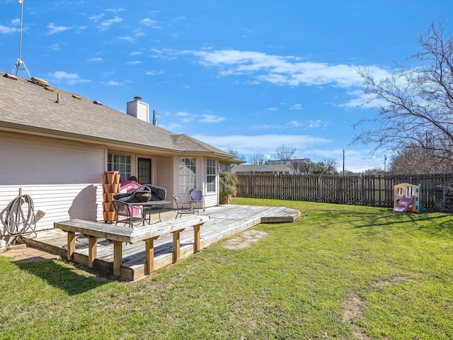 view of yard featuring a wooden deck and fence private yard