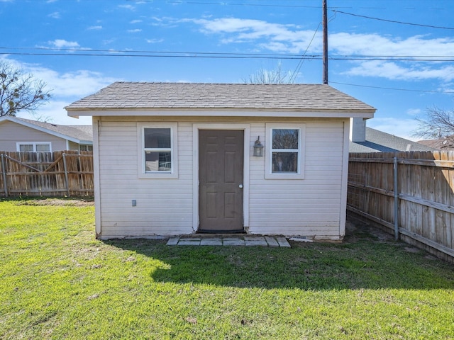 view of shed featuring a fenced backyard