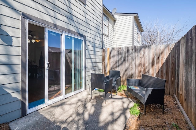 view of patio featuring fence