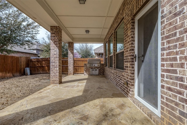 view of patio featuring a grill and a fenced backyard