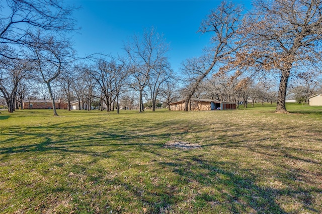 view of yard with a barn and an outdoor structure