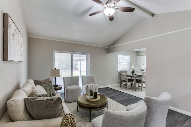 living room with lofted ceiling with beams, baseboards, and dark wood-style flooring