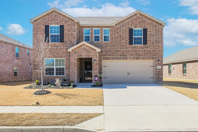 traditional-style home featuring brick siding, an attached garage, and driveway