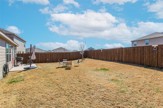 view of yard with a patio and a fenced backyard