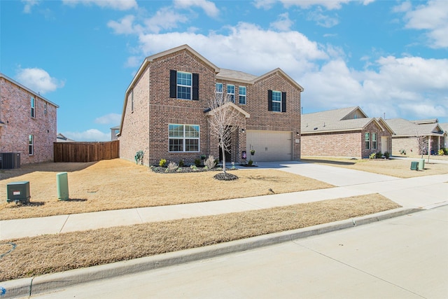 traditional home with fence, driveway, central AC, a garage, and brick siding