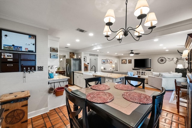 dining space with recessed lighting, visible vents, and crown molding