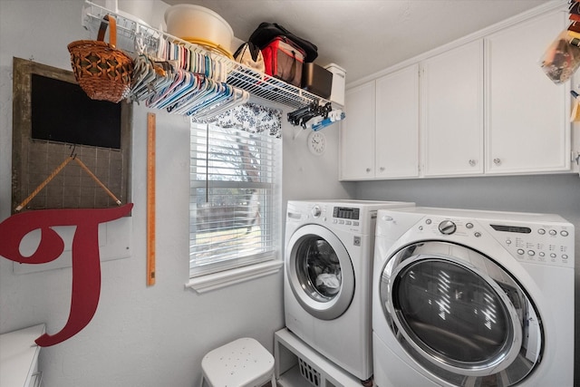 laundry room with cabinet space and independent washer and dryer