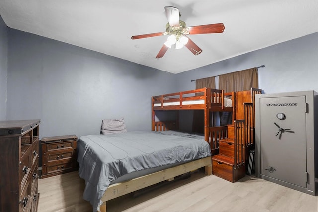 bedroom with a ceiling fan and wood finished floors