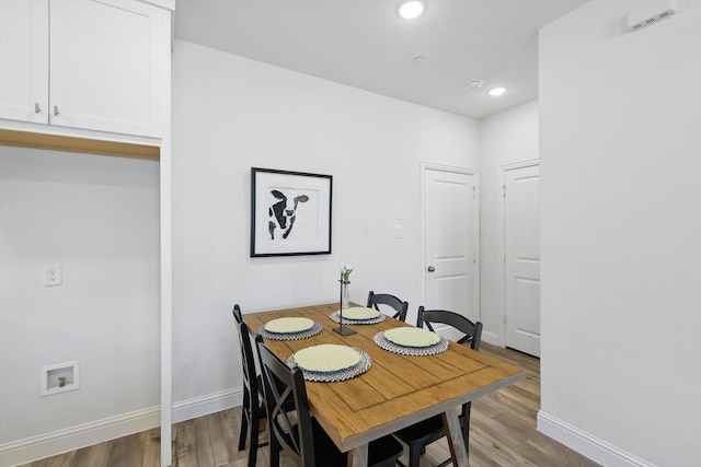 dining space featuring visible vents, recessed lighting, baseboards, and wood finished floors