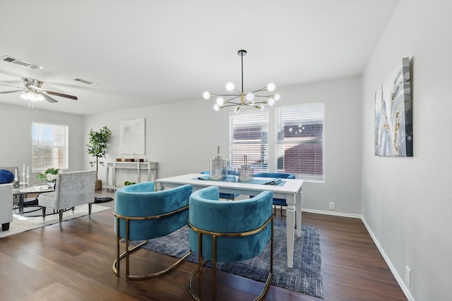 dining room featuring dark wood-type flooring, baseboards, and visible vents