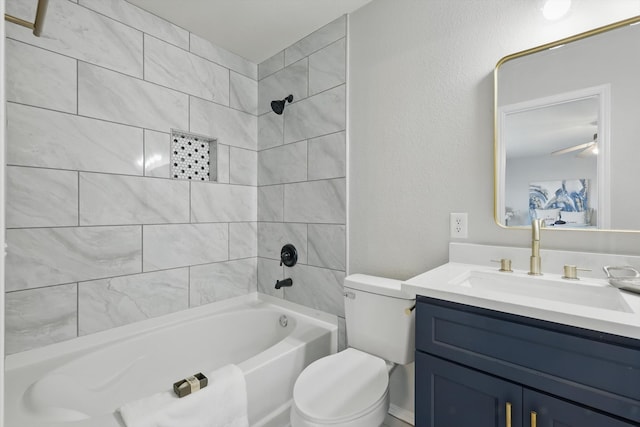 full bath featuring toilet, vanity, bathtub / shower combination, and ceiling fan