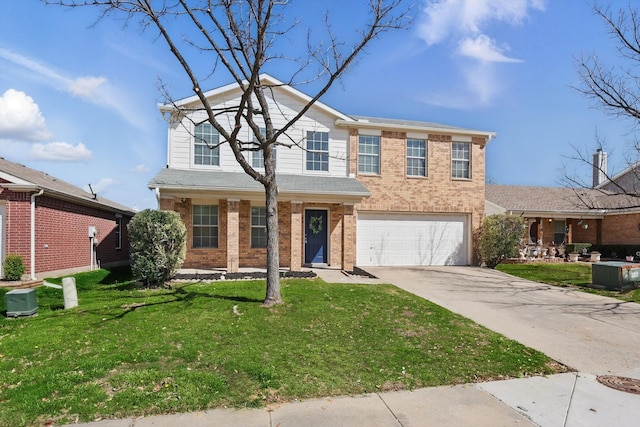 traditional-style home featuring a front lawn, a garage, brick siding, and driveway