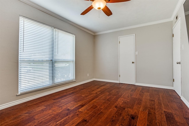 empty room featuring visible vents, baseboards, ornamental molding, wood finished floors, and a ceiling fan