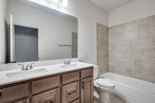 full bath featuring tile patterned flooring, double vanity, toilet, and a sink