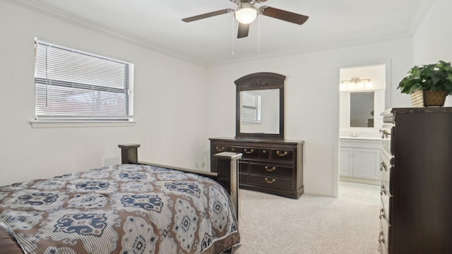 bedroom with ensuite bath, crown molding, light colored carpet, and a ceiling fan