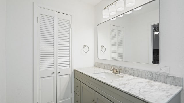 bathroom featuring a closet and vanity