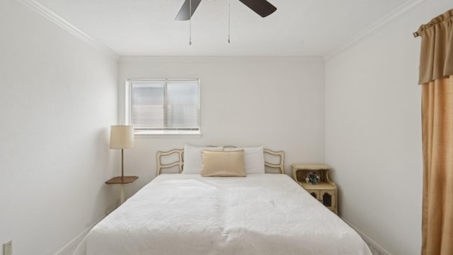 bedroom with ceiling fan, baseboards, and ornamental molding