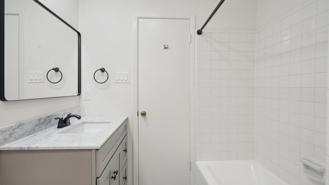 bathroom with vanity and shower / tub combination