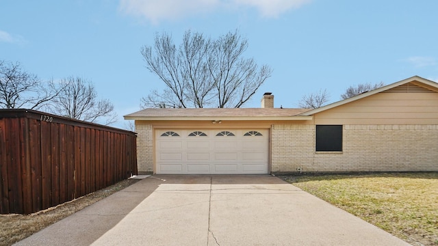 garage with concrete driveway