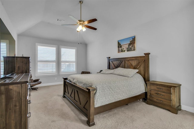 bedroom with vaulted ceiling, multiple windows, visible vents, and light carpet