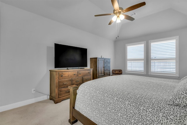 bedroom featuring visible vents, baseboards, ceiling fan, vaulted ceiling, and light carpet