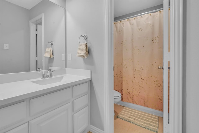 bathroom featuring tile patterned floors, toilet, vanity, and a shower with curtain