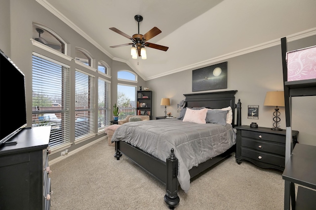 bedroom featuring crown molding, ceiling fan, light colored carpet, and vaulted ceiling