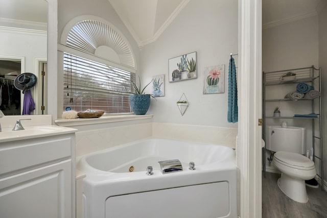 full bathroom with crown molding, vanity, toilet, a jetted tub, and wood finished floors