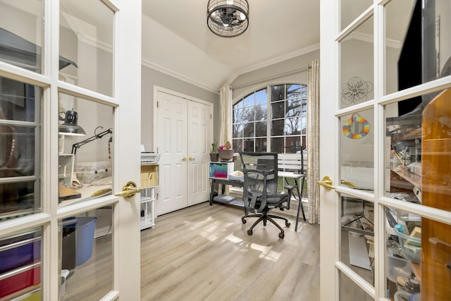 office featuring ornamental molding, wood finished floors, and lofted ceiling