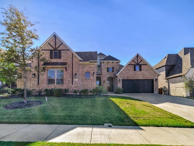 view of front of house with concrete driveway, brick siding, and a front yard