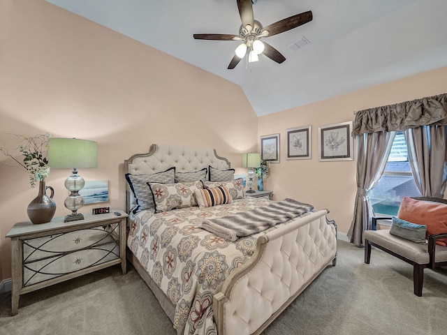 carpeted bedroom with lofted ceiling, baseboards, visible vents, and ceiling fan