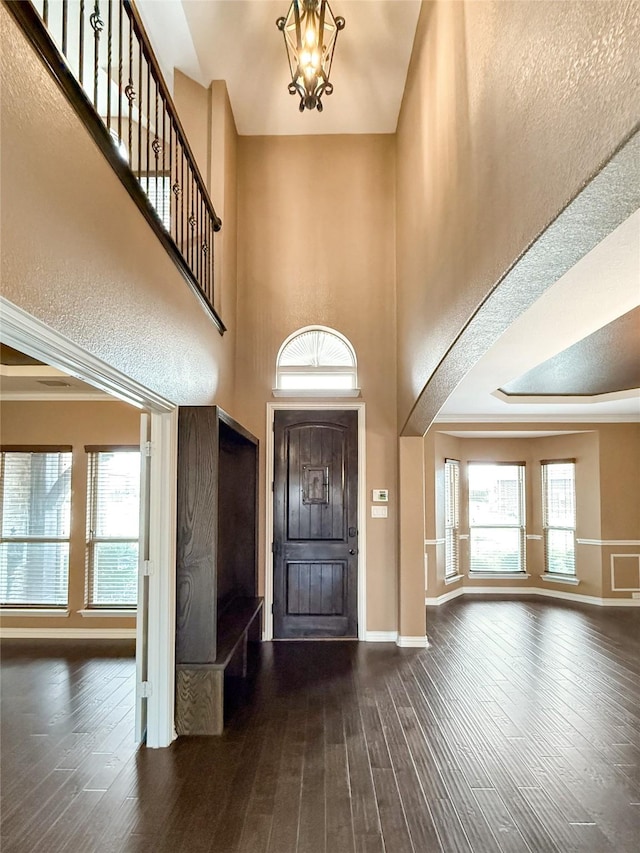 1236 Cirrus Ct, Forney, TX 75126 - entryway with baseboards, hardwood / wood-style flooring, a chandelier, and a high ceiling