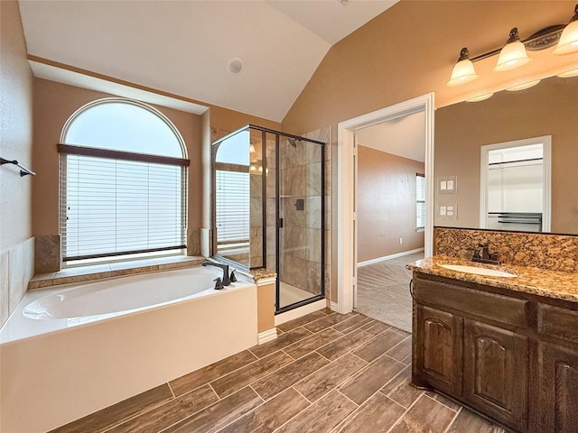 1236 Cirrus Ct, Forney, TX 75126 - bathroom featuring a bath, a shower stall, vaulted ceiling, and vanity