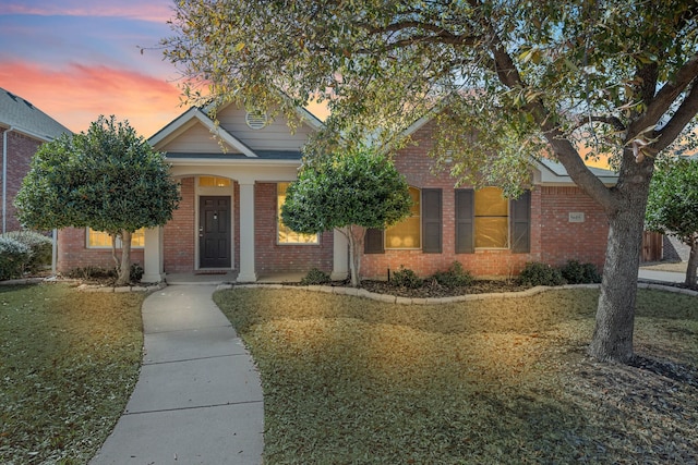 view of front of property featuring brick siding