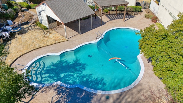 pool featuring a patio area, a pergola, and fence