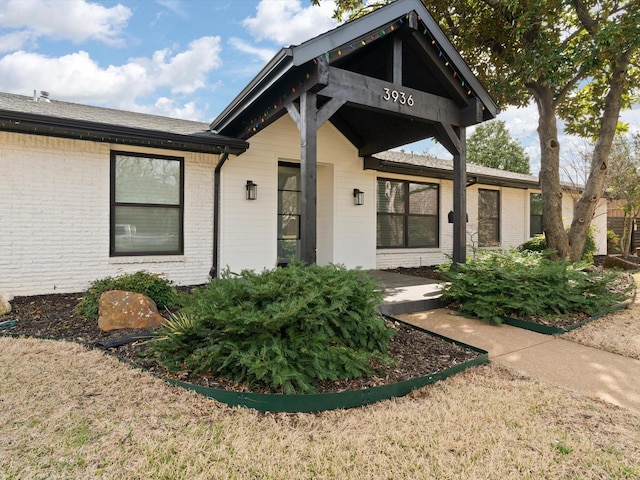 view of front of property with brick siding