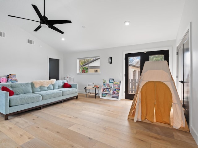 living room featuring ceiling fan, visible vents, light wood-style flooring, and recessed lighting