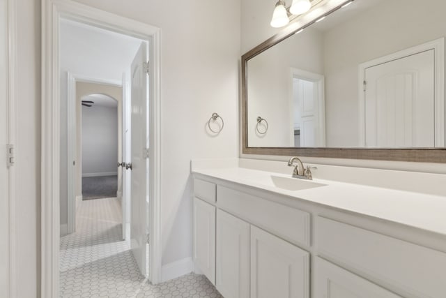 bathroom featuring baseboards, vanity, and tile patterned flooring