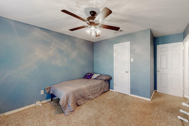 bedroom with carpet, visible vents, and baseboards