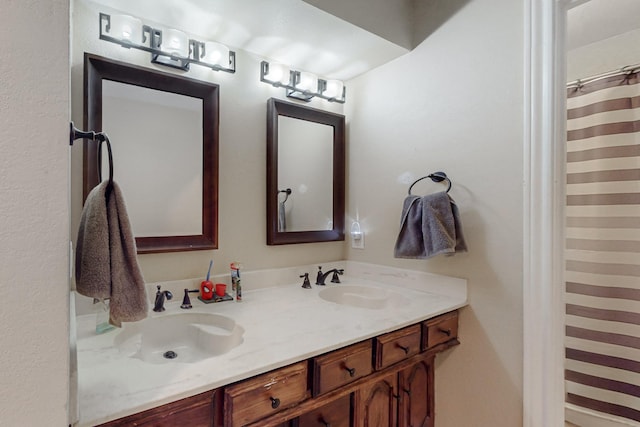 bathroom with double vanity and a sink