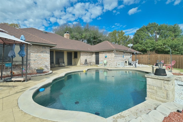 view of pool featuring a patio, fence, and a fenced in pool