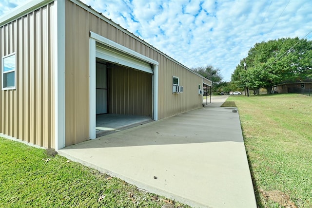 exterior space featuring a lawn and an attached garage