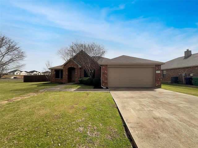 ranch-style house with brick siding, an attached garage, driveway, and a front lawn