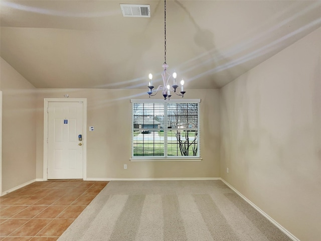 unfurnished dining area featuring baseboards, visible vents, an inviting chandelier, tile patterned flooring, and vaulted ceiling