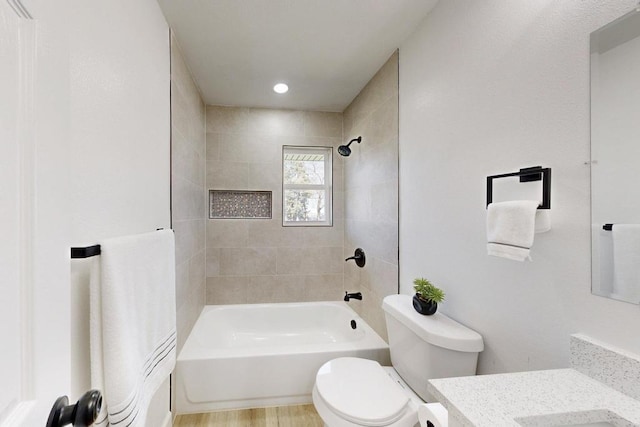 bathroom featuring vanity,  shower combination, toilet, and wood finished floors