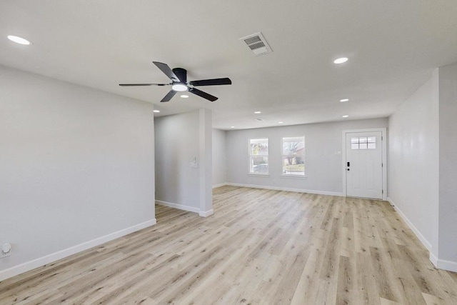 interior space with light wood finished floors, visible vents, recessed lighting, and baseboards